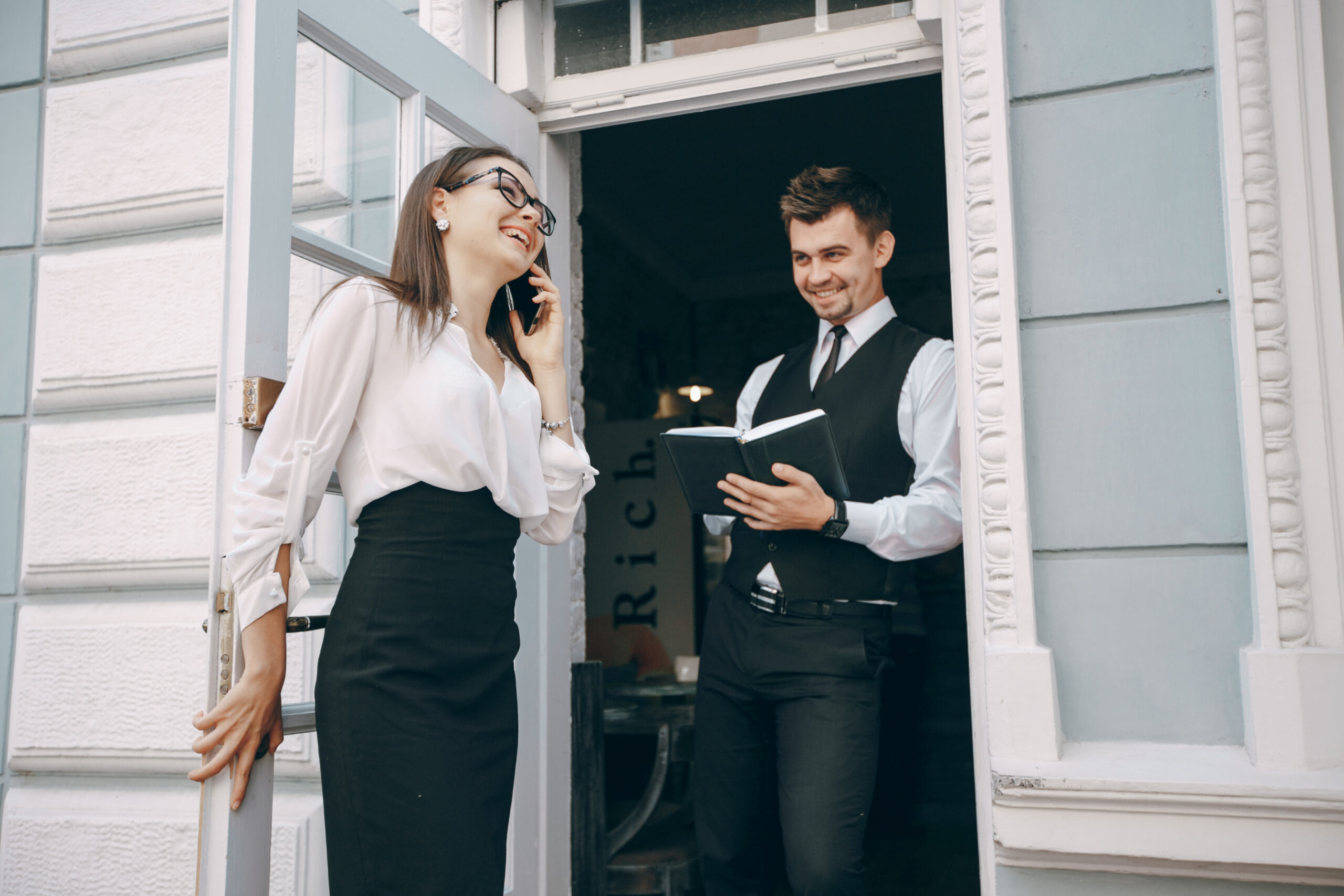 man and woman in business attire are meeting